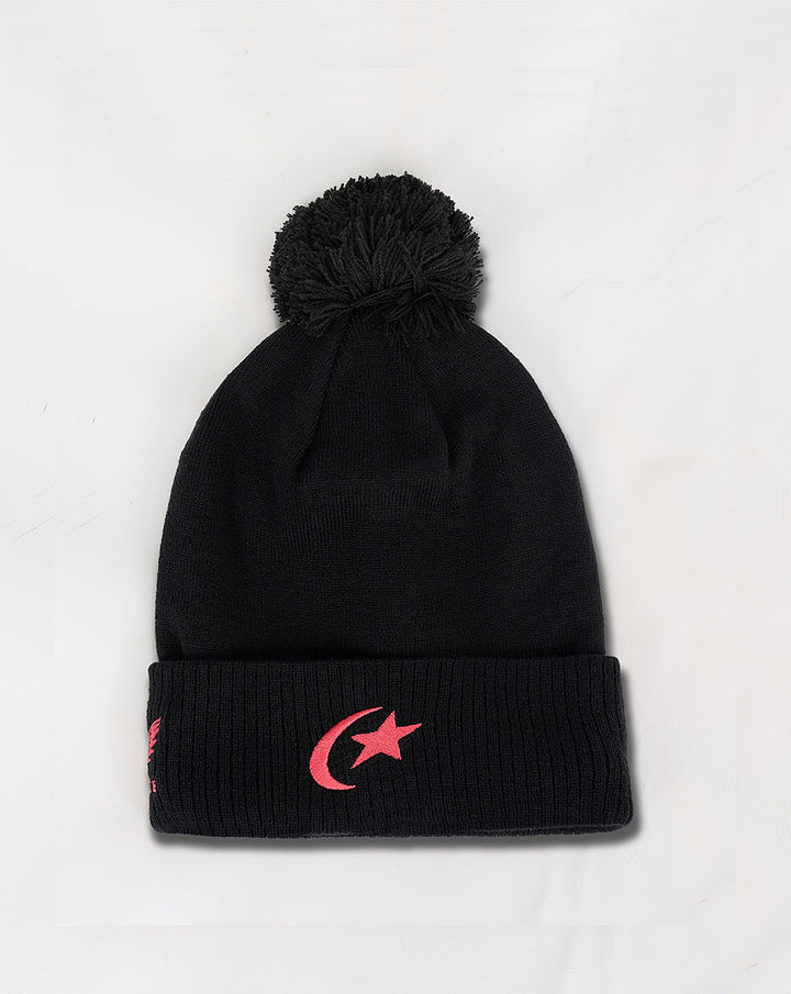 Black bobble beanie with a pom pom on top and pink crescent moon emblem on the folded cuff