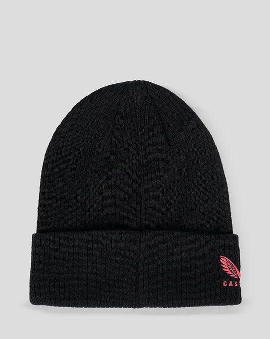 Front view of black knit beanie with pink crescent moon and star embroidery on the folded cuff