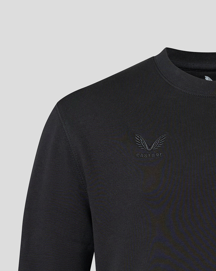 Detail of tonal Castore logo embroidery on the chest of the black Saracens sweatshirt.