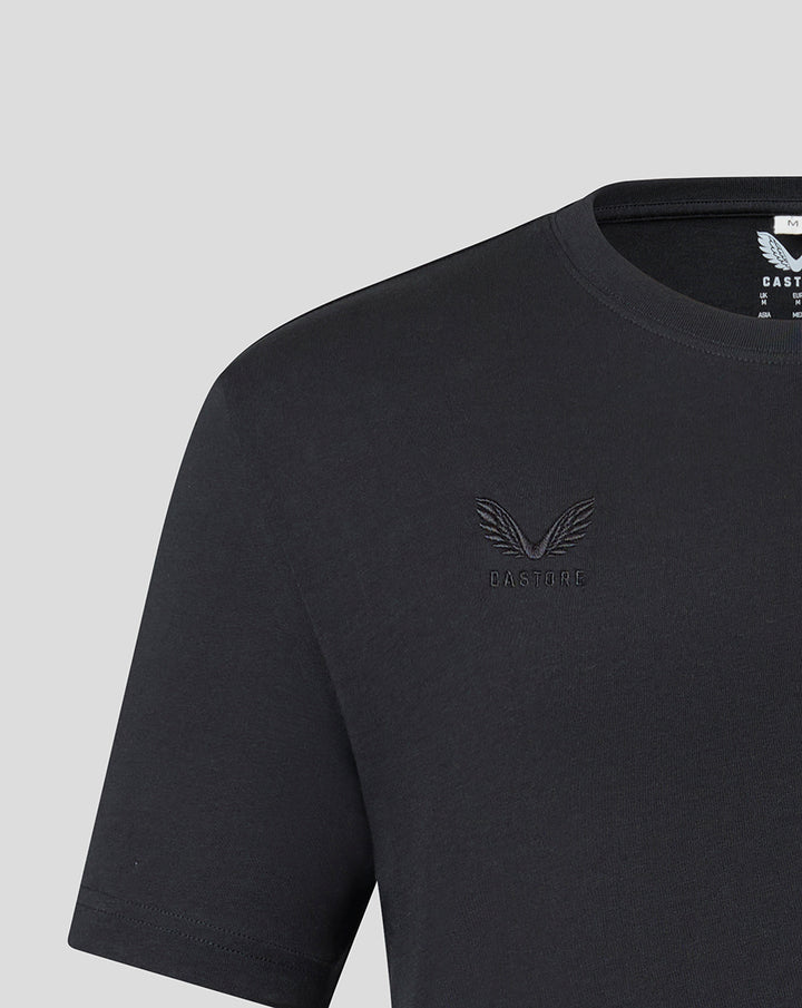 Close up of black T-shirt chest area with tonal embroidered Saracens crest and Castore branding