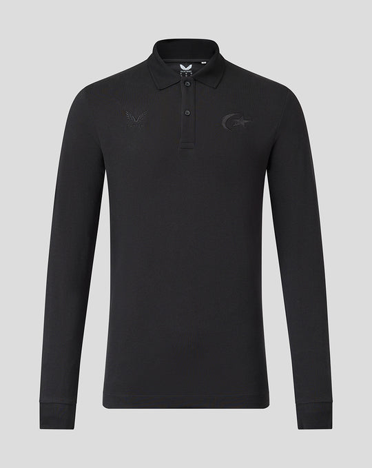 Front view of black long sleeve polo with tonal Saracens crest and Castore branding, classic polo collar and two-button placket.