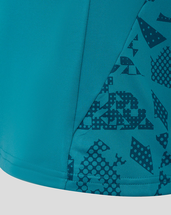 Close up of storm blue Women's England Rugby long sleeve midlayer showing abstract printed sleeve and side panel design.