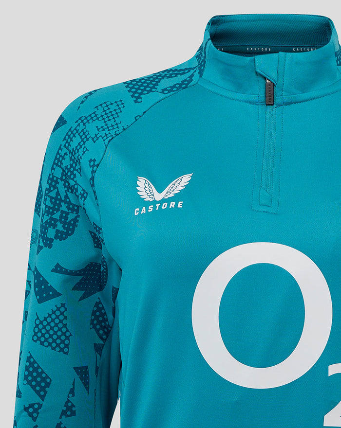 Front close-up of storm blue midlayer showing funnel neck center quarter-zip rose crest left chest O2 logo center and Castore branding on right chest
