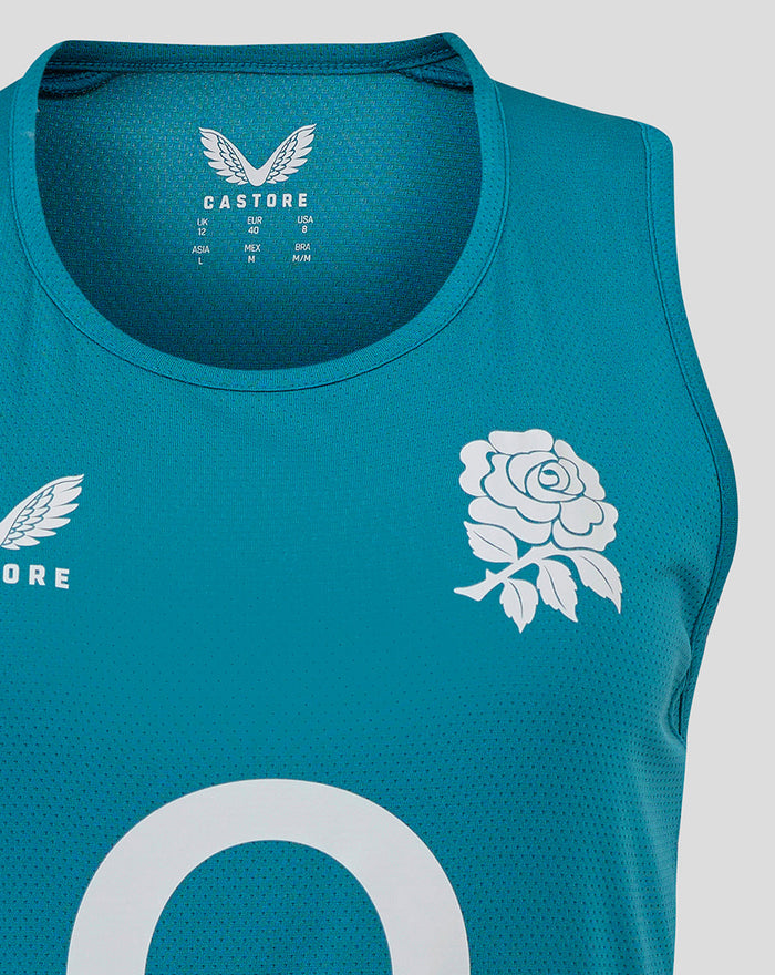 Close-up of chest area on storm blue England Rugby sleeveless top showing Castore logo on left and rose crest on right