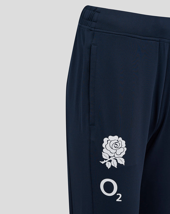 Side view of navy knit pants with a white rose crest and O2 logo on the thigh.