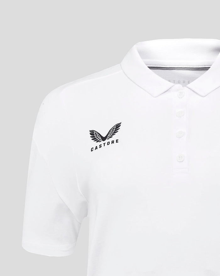 Close-up of white polo chest showing Castore branding on the front