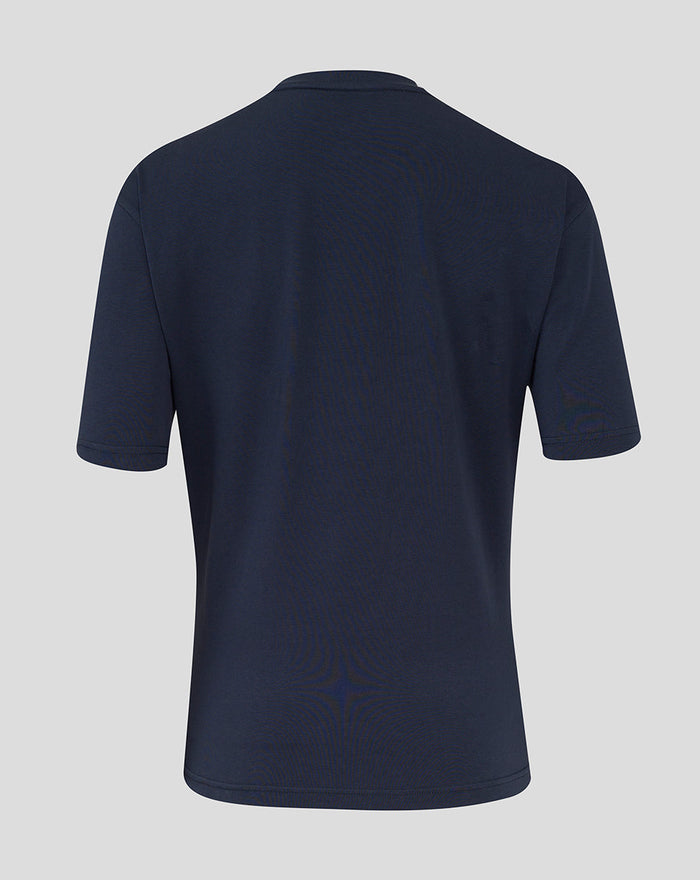 Chest detail of navy England Rugby Travel Tee showing rose crest on left and Castore logo on right