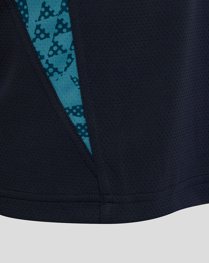Side view of navy England Rugby T Shirt with teal patterned side panel insert along the hem