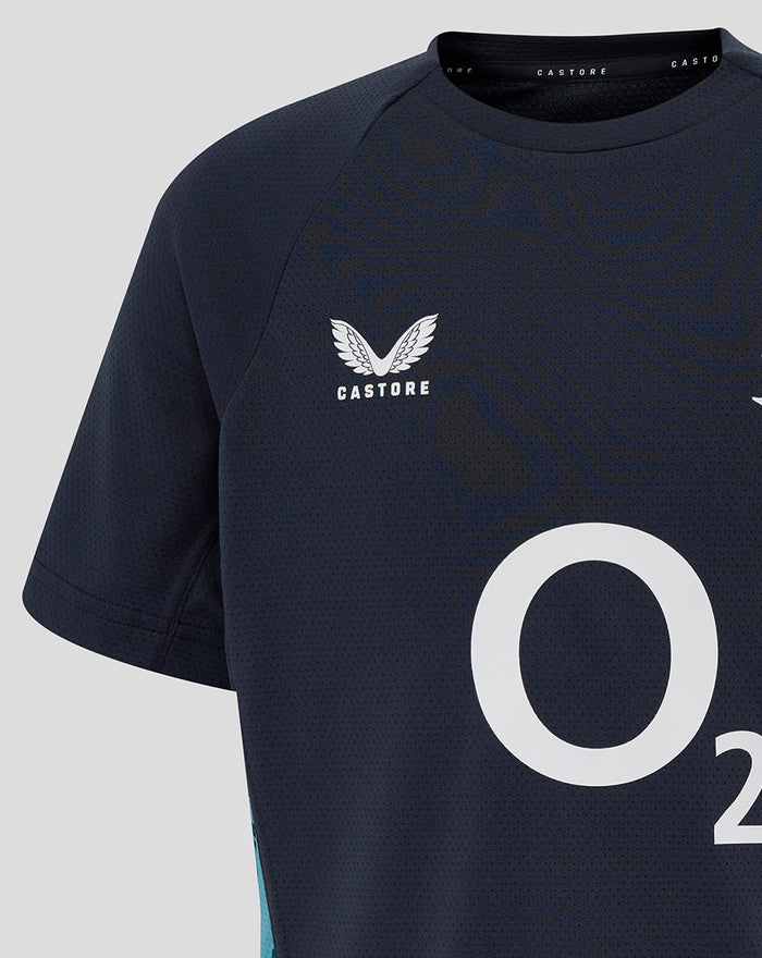 Front close up of navy Junior England Rugby Performance T Shirt showing Castore logo on chest and textured fabric