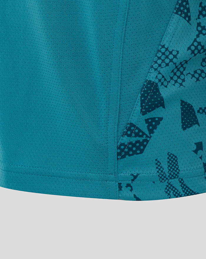 Close up of lower front and side panel of Storm Blue rugby tee with seam and sleeve pattern