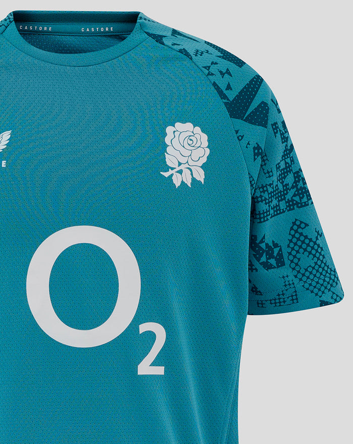 Close up of Junior England Rugby Storm Blue short sleeve tee with a white rose crest on the chest and a large O2 logo center front