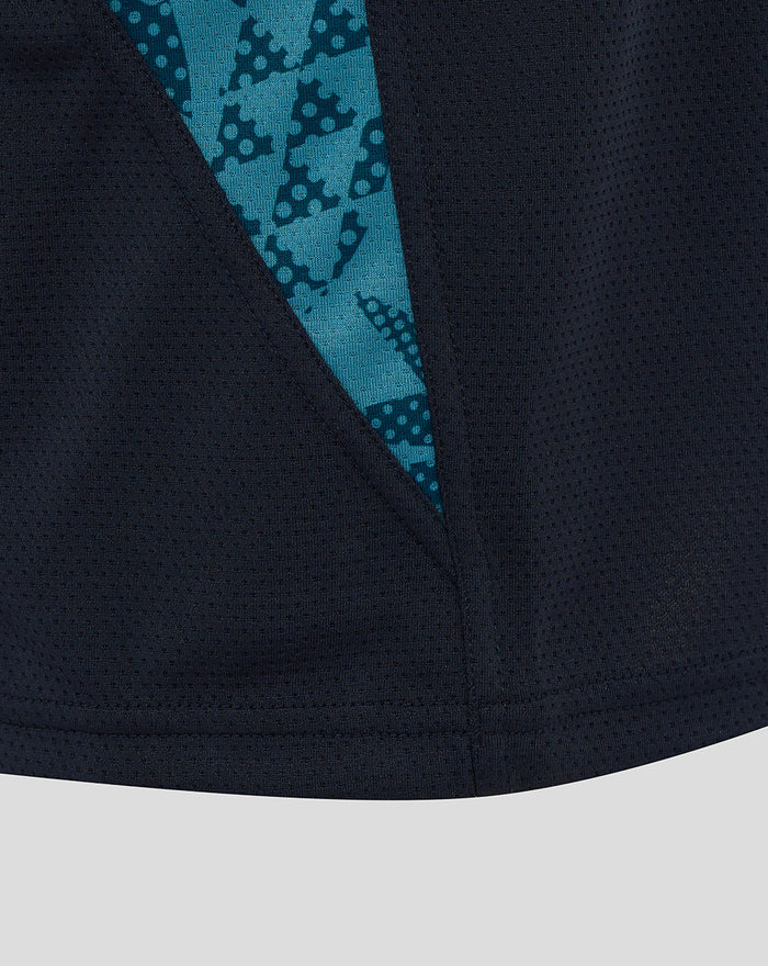 Close up of navy fabric with teal abstract side panel from the Junior England Rugby sleeveless T shirt Inkwell.