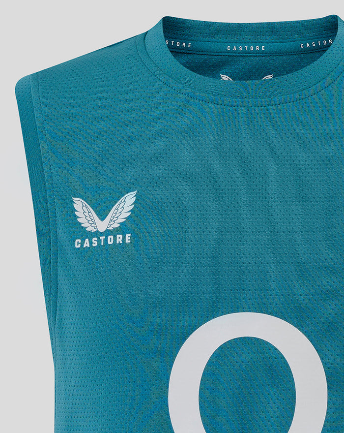 Close up of storm blue junior England rugby sleeveless T shirt front showing rose crest on left chest and large O2 logo in centre with Castore branding.