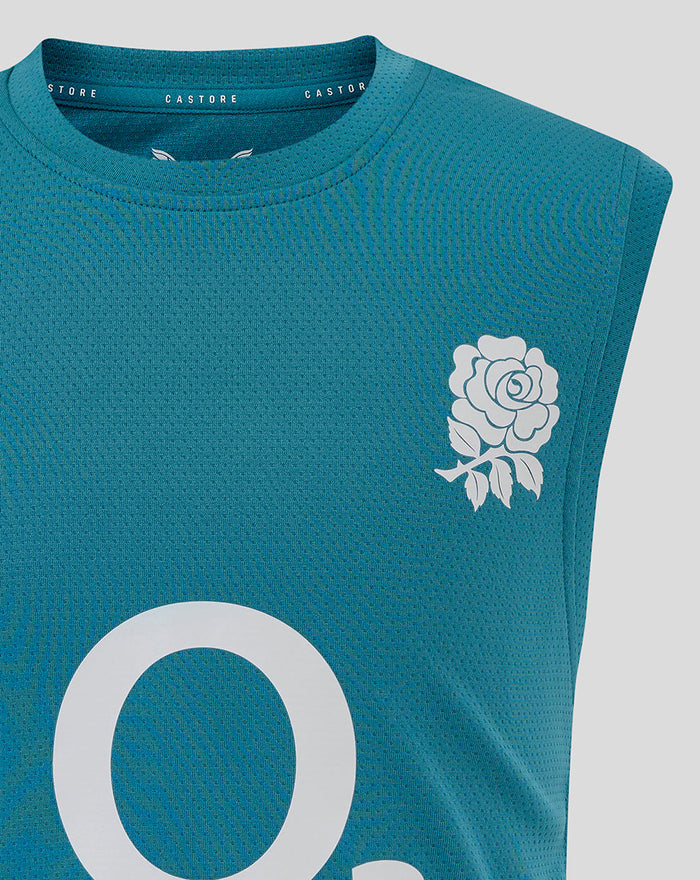 Front chest close up of storm blue junior England rugby sleeveless T shirt highlighting the rose crest and prominent O2 center logo with Castore branding on the neckline.
