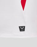 Close-up of a white Junior England Rugby home shirt showing a red side panel and Castore authentication patch at the hem