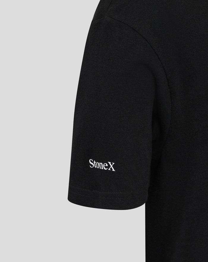 Close-up of black JUNIOR SHOWDOWN 25 Tee sleeve with white StoneX logo