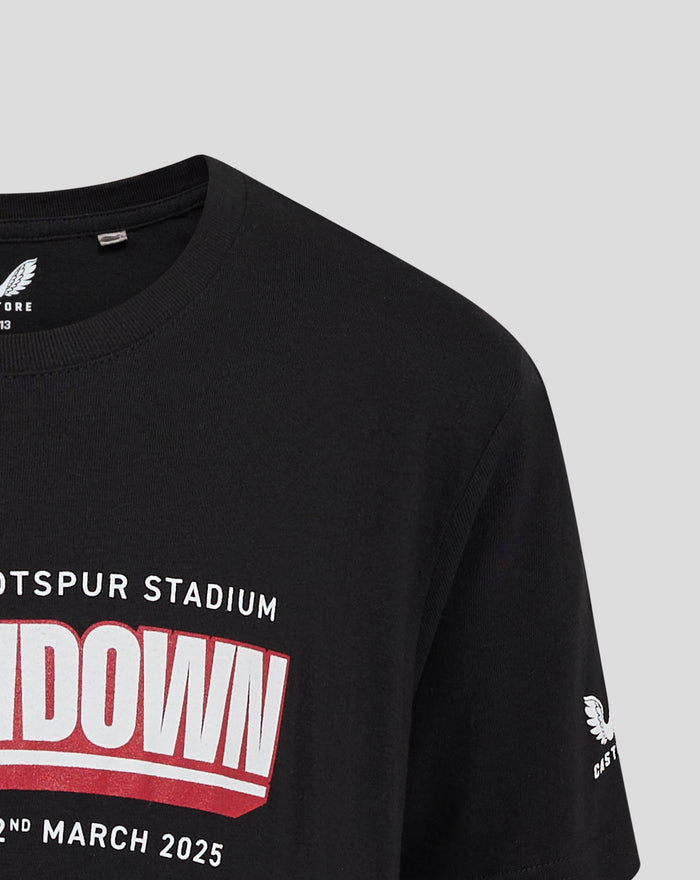 Front view of black Junior Showdown 25 tee with bold red and white graphic and Tottenham Hotspur Stadium text.