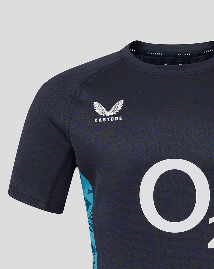 Chest of navy England jersey showing white rose crest and Castore branding with O2 logo partially visible