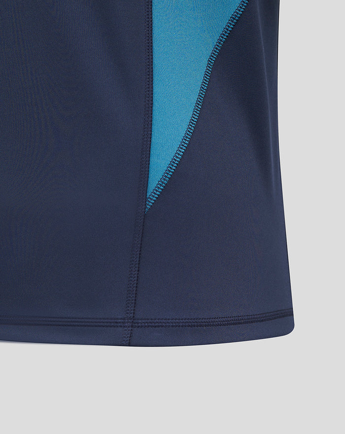 Close-up of navy fabric with teal side panel from the Men’s England Rugby Inkwell drill top.