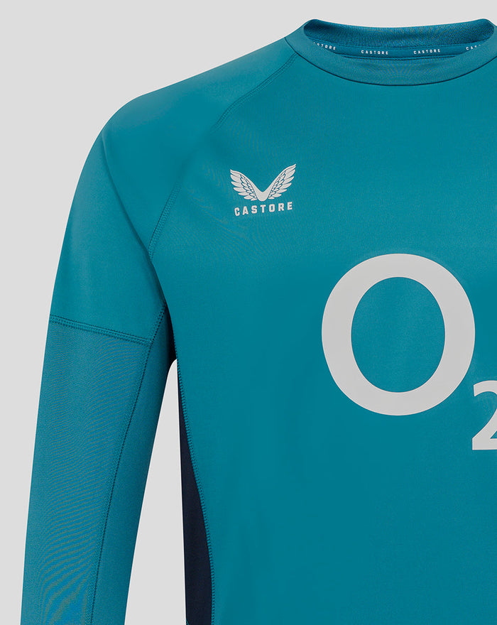 Storm blue men's England rugby drill top with Castore logo on the chest and a large O2 sponsor graphic across the front.