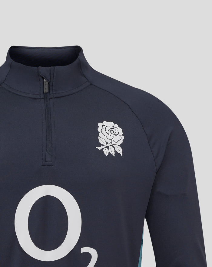 Close up of navy midlayer chest with white rose crest and zipper detail