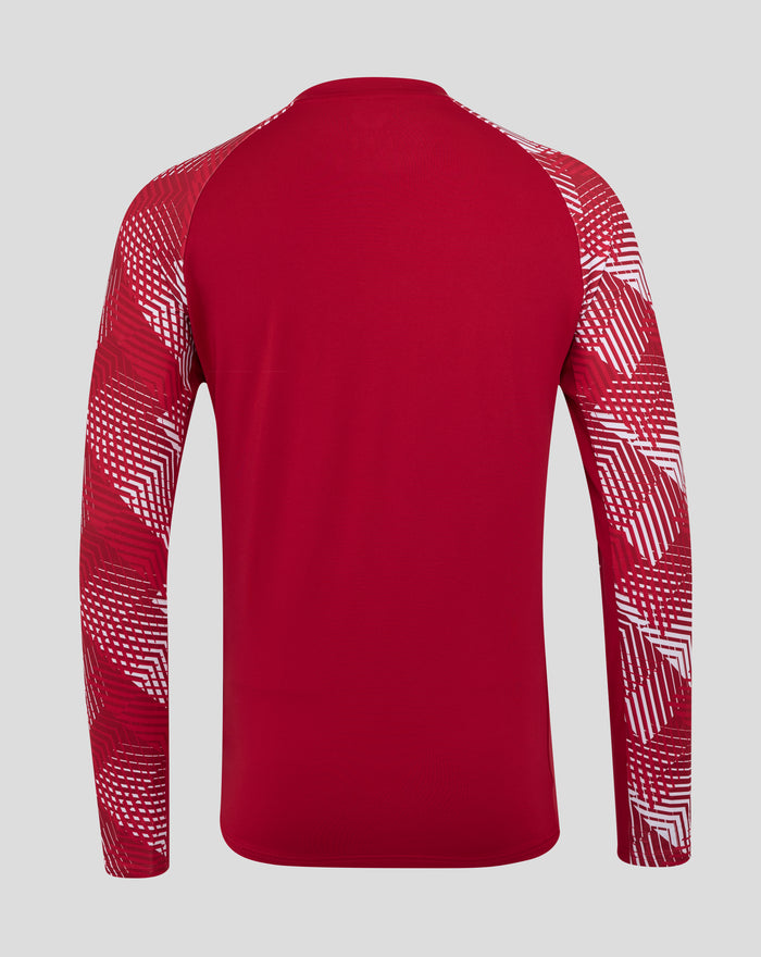 Front view of the red England drill top showing the large white O2 sponsor logo and the rose crest on the chest.