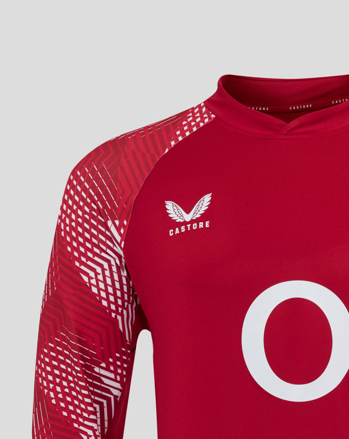 England pre match drill top in red with a geometric sleeve pattern and white crest on the chest