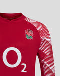 Back view of the red England drill top with bold geometric sleeve print and a crew neck collar.
