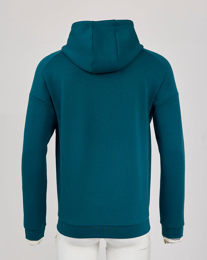 Back view of teal England Rugby travel overhead hoodie with hood up and ribbed hem.