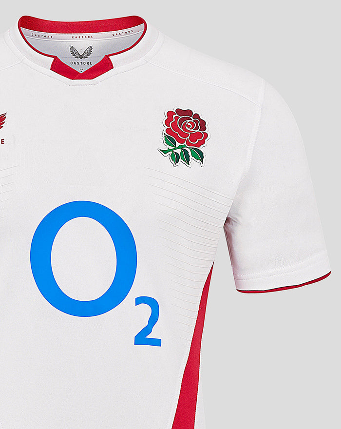 Front view of white England rugby home pro shirt with rose crest on the chest and large blue O2 logo across the front.