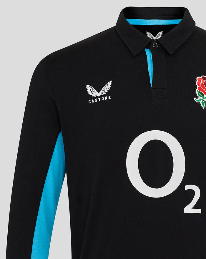 Black England rugby shirt close up with Castore logo on left chest, O2 center logo, and blue side panel.
