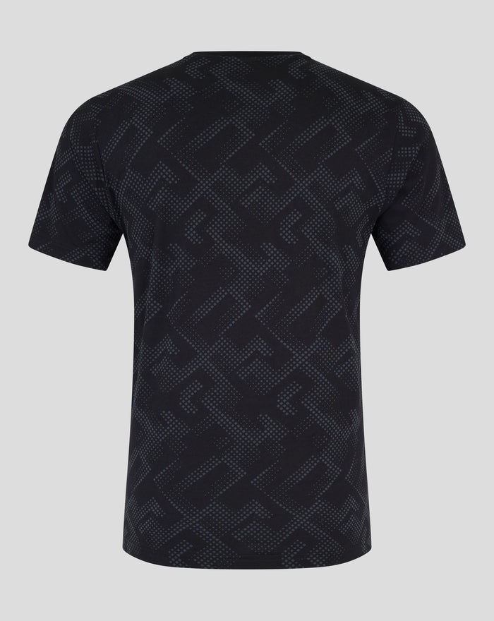 Back view of black short sleeve pajama top with an allover geometric dot pattern