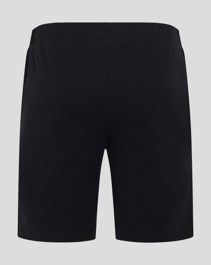 Back view of black men's short pajama shorts with an elastic waistband