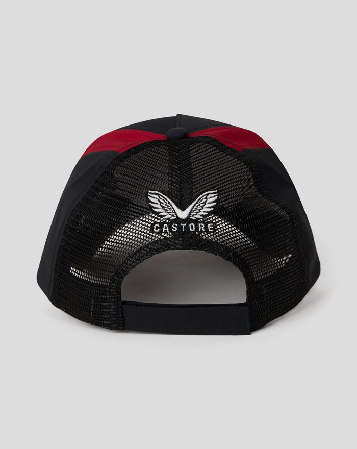 Rear view of a black cap with red panels and mesh back, featuring Castore branding