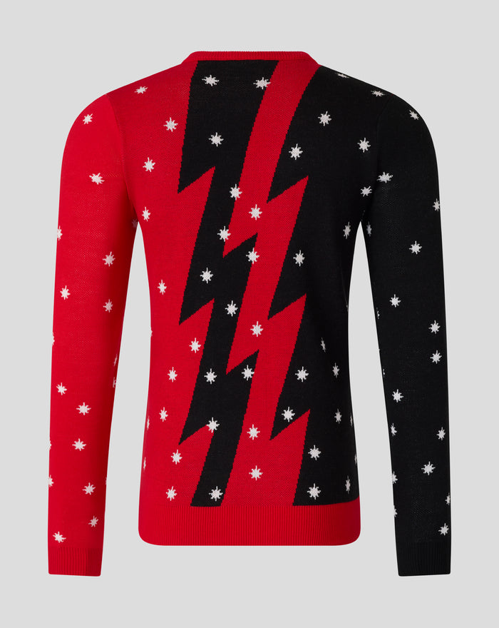 Back view of adults Christmas jumper showing red and black color blocks with a bold diagonal stripe and white snowflakes.