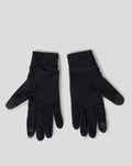 Close-up of black gloves showing textured palms and the Castore wing logo on the cuff