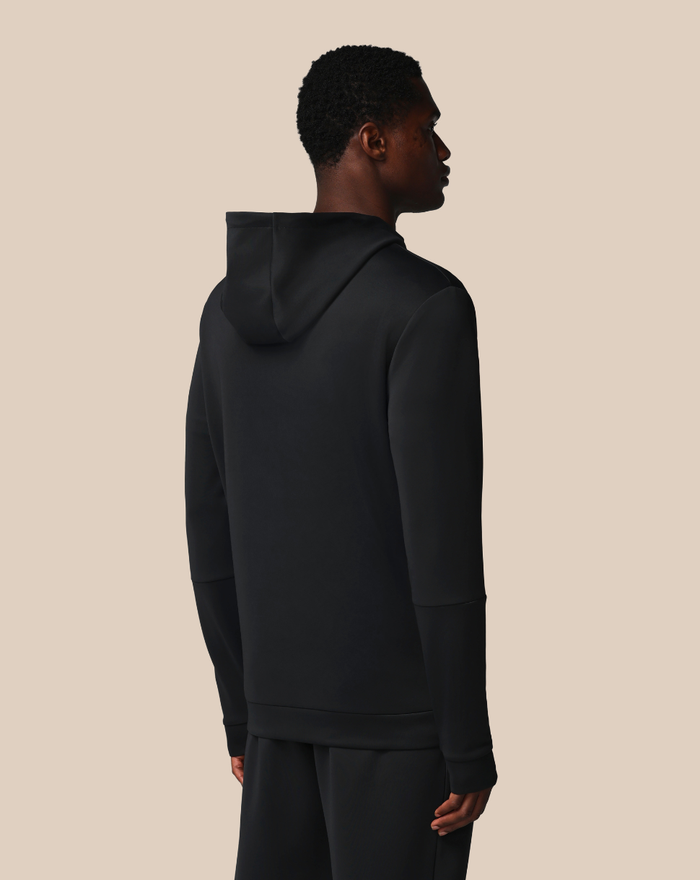Back view of a black FLEX HOODIE on a male model with the hood down.