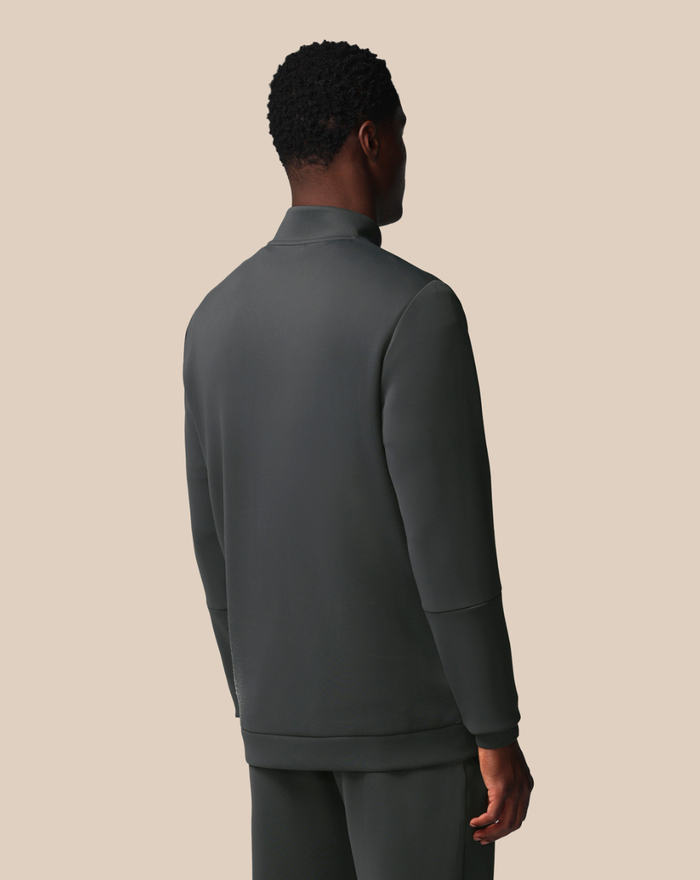 Back view of FLEX 1/4 ZIP SWEATSHIRT in dark gray on a male model