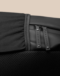 Close-up of the CORE BACKPACK zipper area with dual pulls branded CASTORE