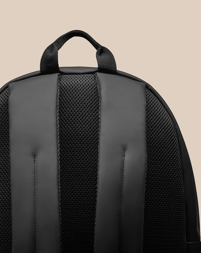 Back view of CORE BACKPACK showing padded shoulder straps and top grab handle