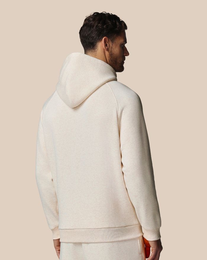 Back view of beige cotton fleece hoodie with hood and relaxed fit